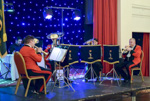 <font size=1>Members of the Corps Band play during the meal.<br><i>Photo courtesy of Kane Gunter</i></font>